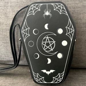 Mad engine Viral coffin purse. Glows in the dark